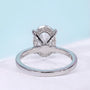 Oval center stone engagement ring with secure claw setting
