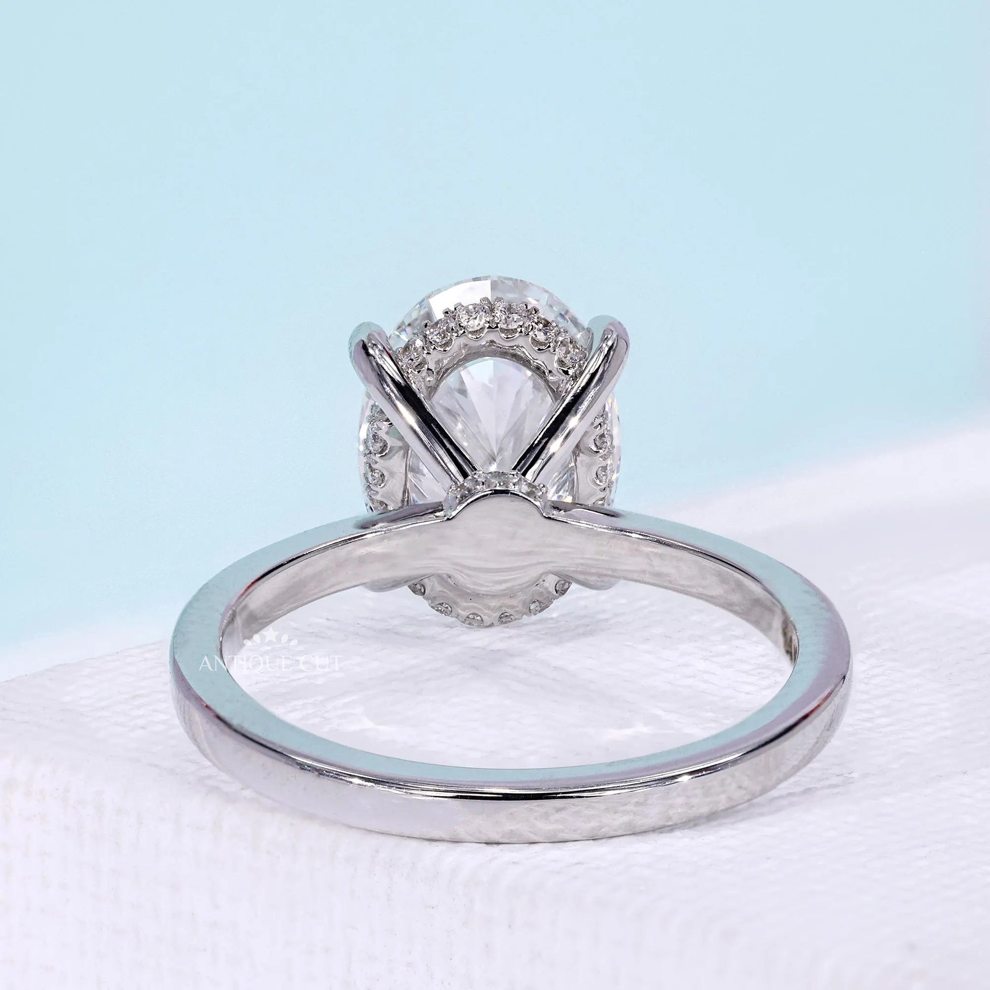 Oval center stone engagement ring with secure claw setting
