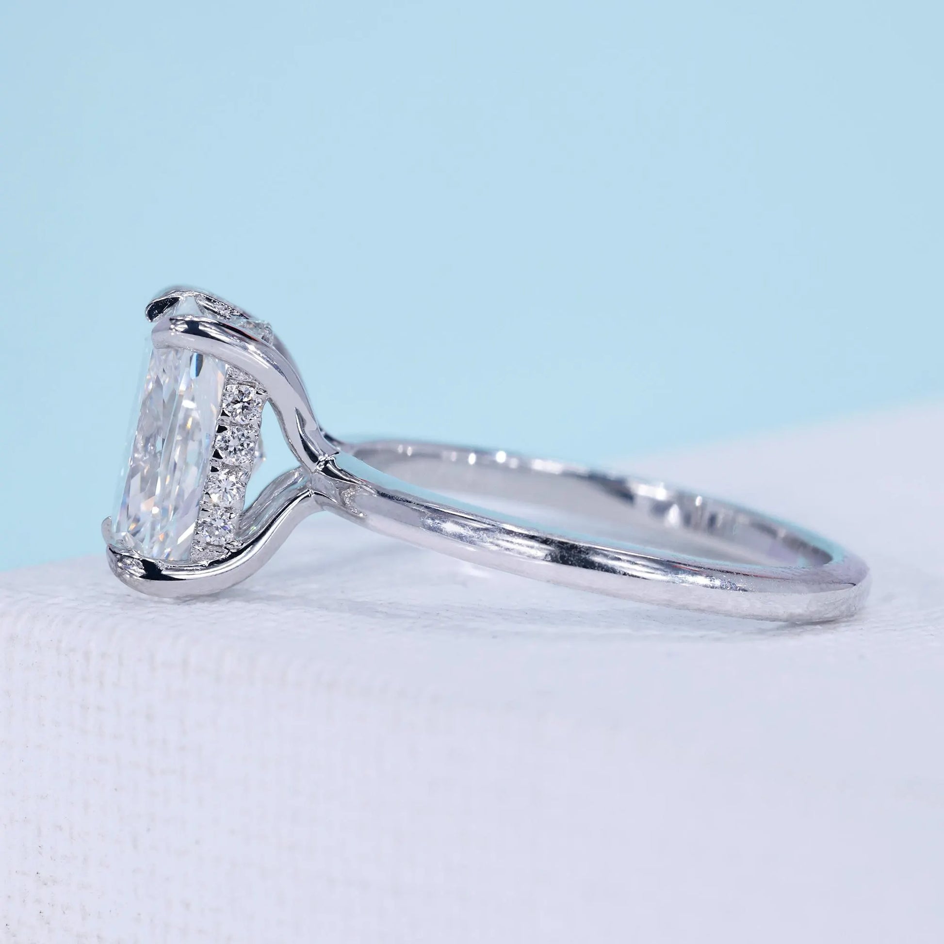 Women’s cushion cut engagement ring with secure claw prong setting
