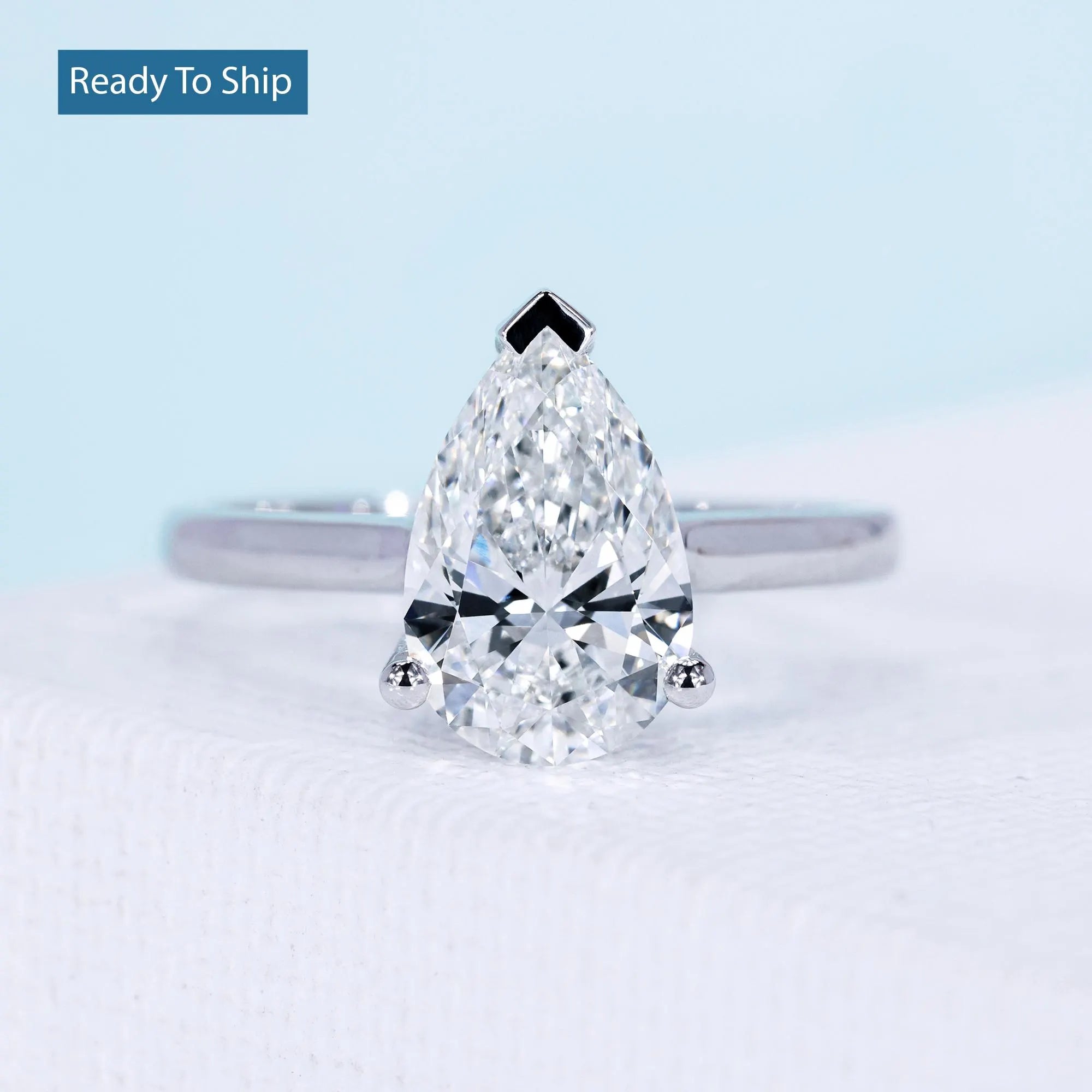 2 carat teardrop diamond ring with hidden halo pear engagement setting
