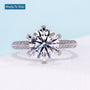 Round brilliant diamond ring with three row pave diamond band in white gold
