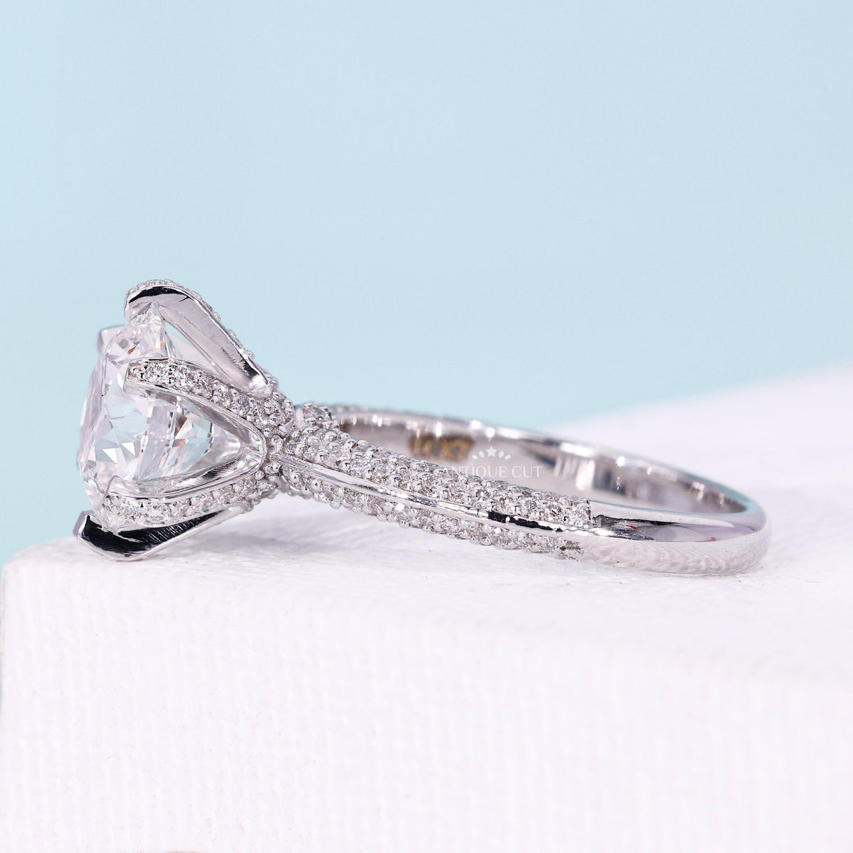 IGI certified round cut diamond halo engagement ring
