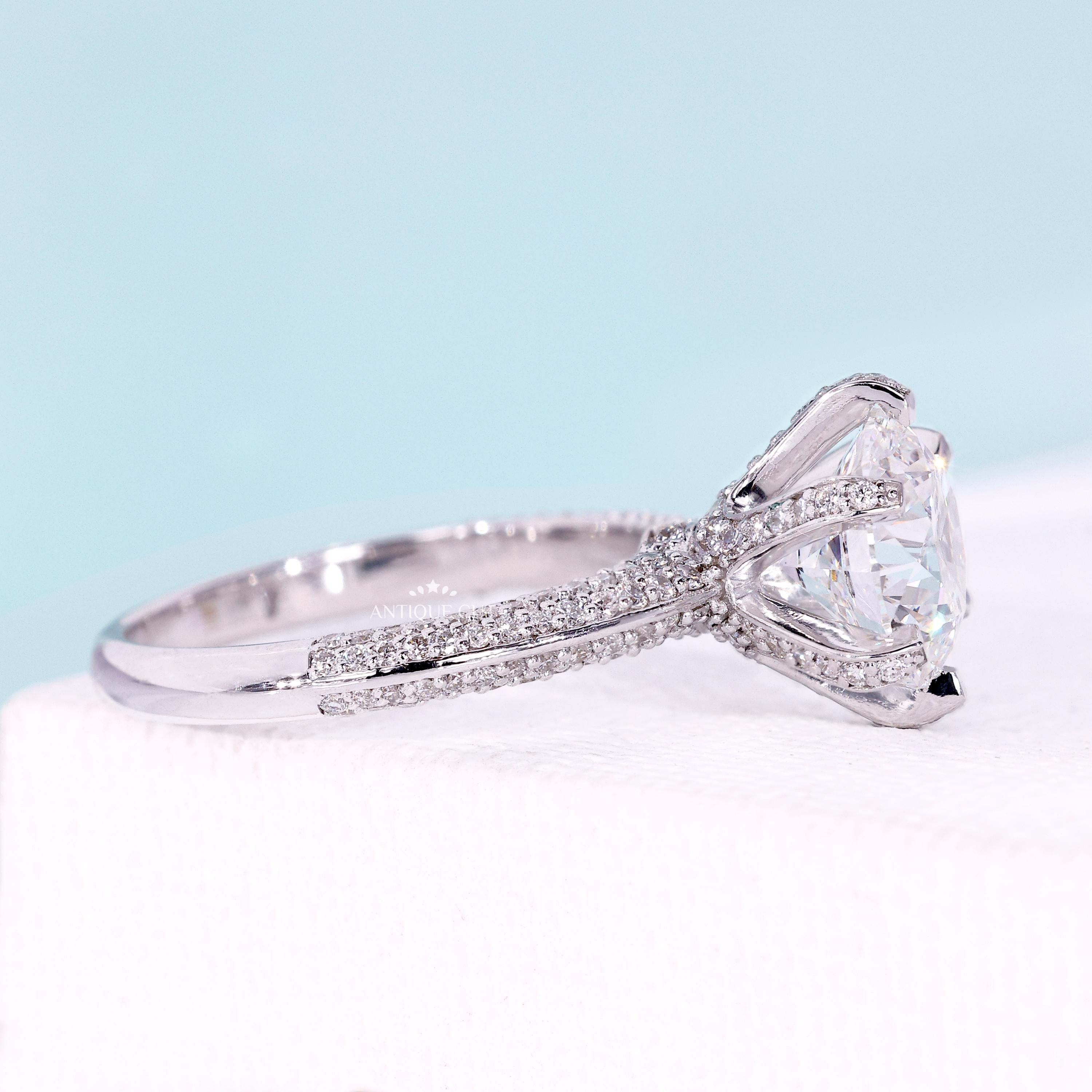 White gold floral halo engagement ring with bridge accent design
