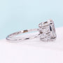 White gold oval diamond engagement ring featuring floral marquise side stones
