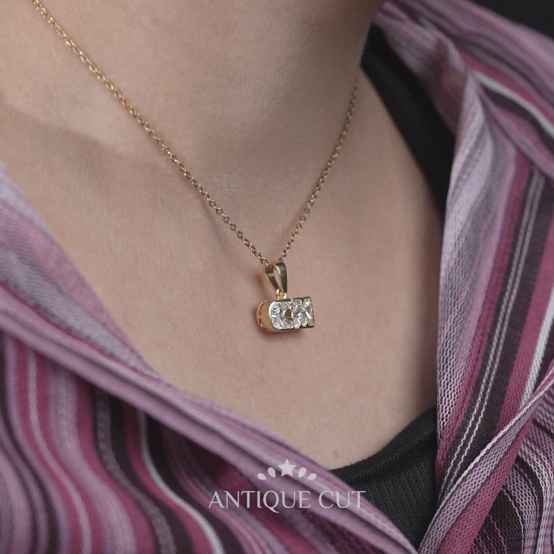 Diamond initial CM pendant with bezel setting