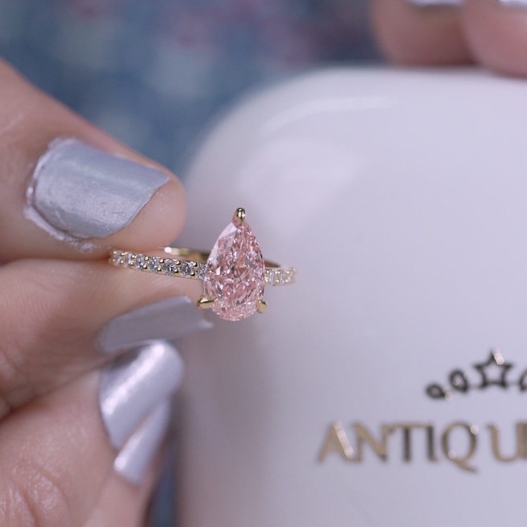 Yellow gold pear pink diamond engagement ring
