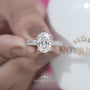 Oval diamond engagement ring in white gold with hidden halo setting