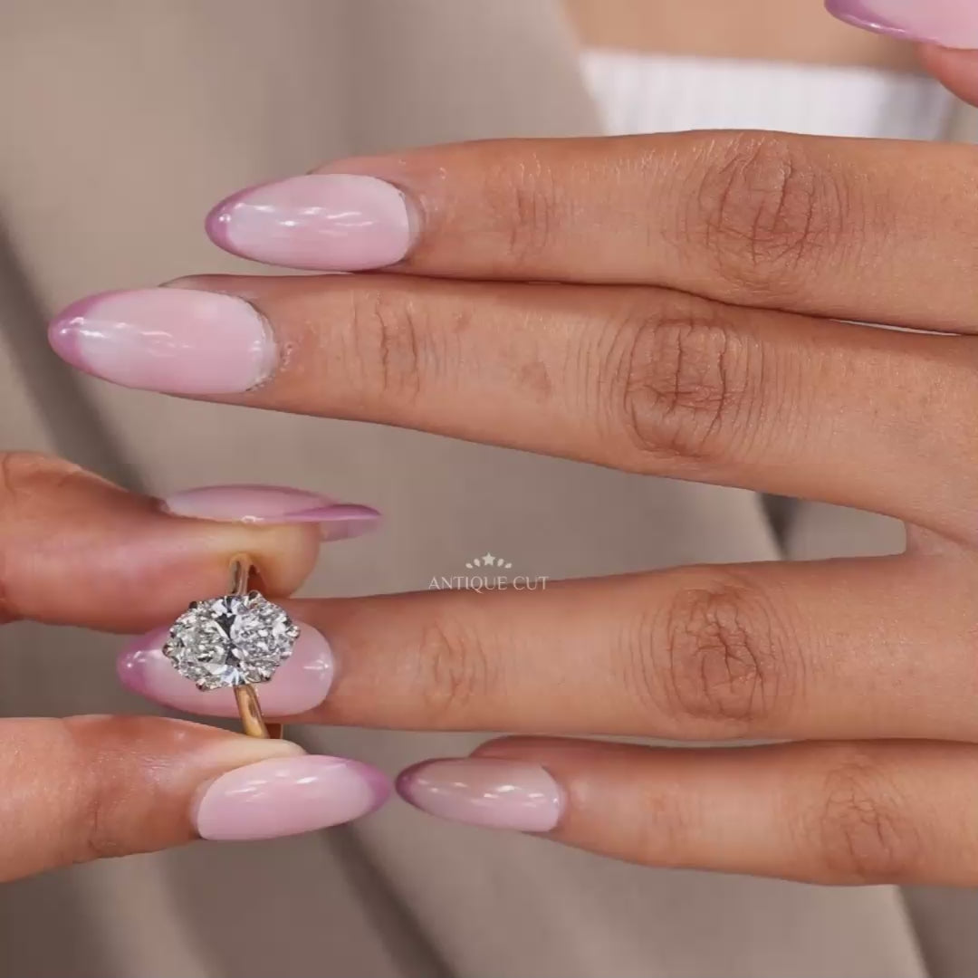 Oval solitaire engagement ring with accent stones