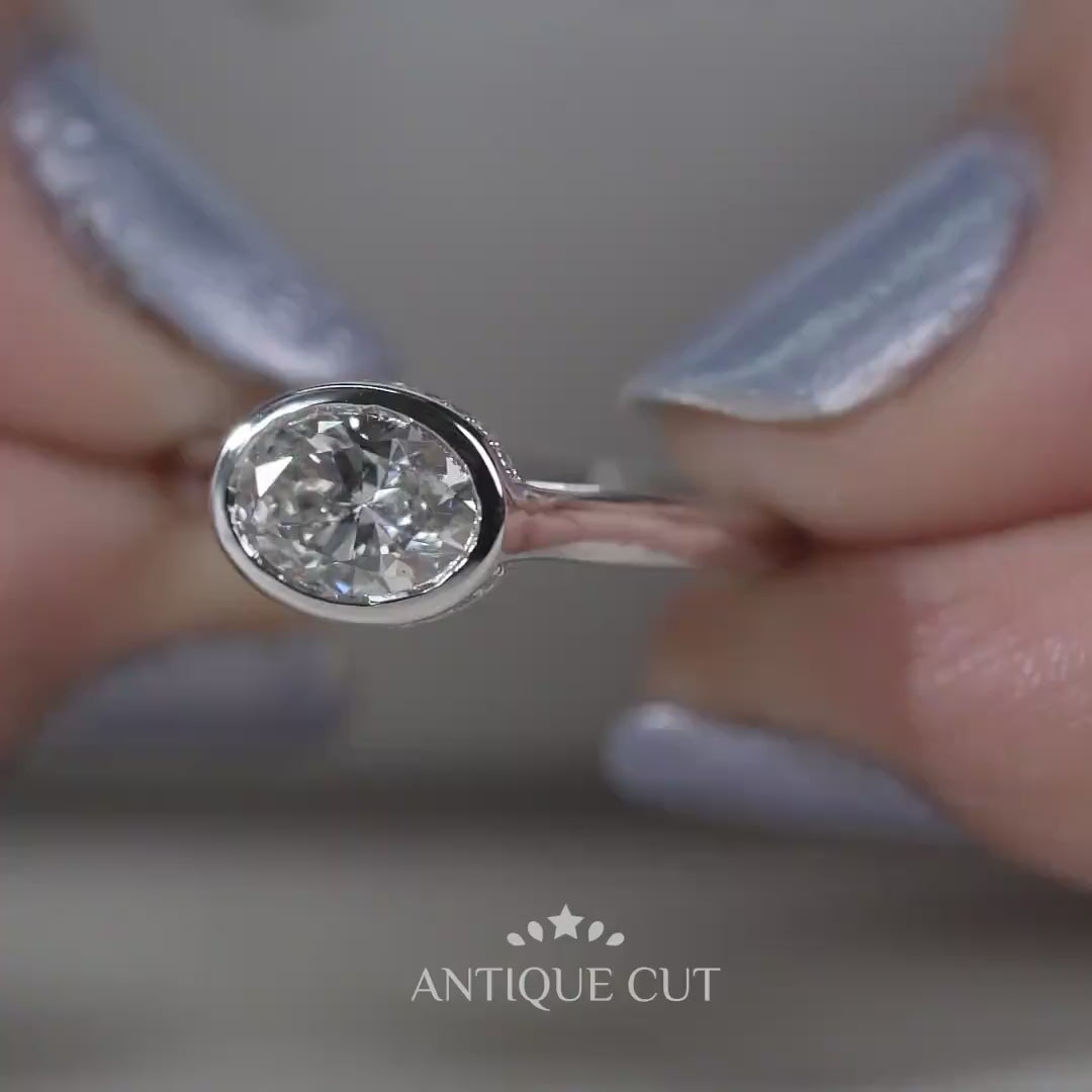 Hidden halo oval engagement ring in white gold