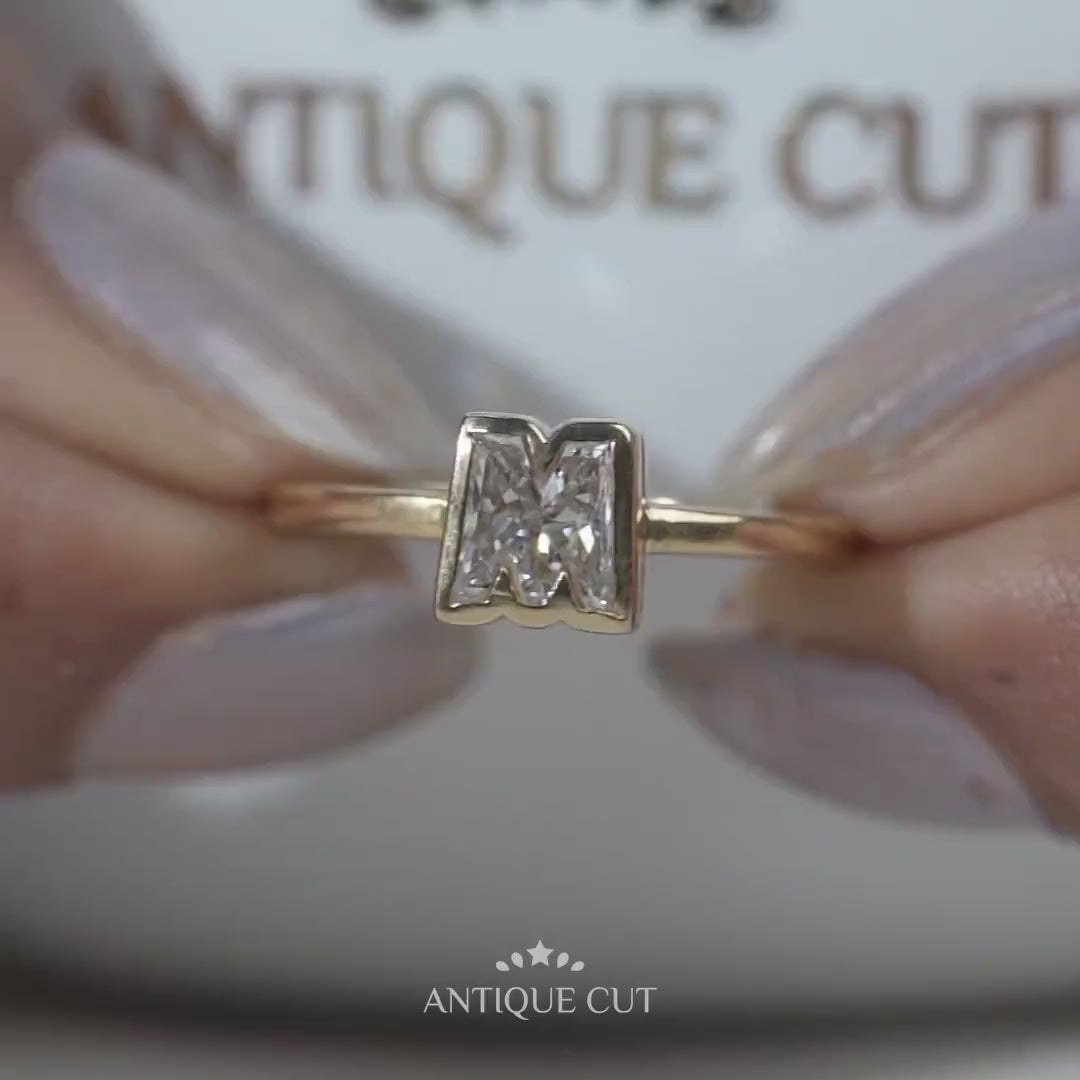 Yellow gold M diamond ring detailed view