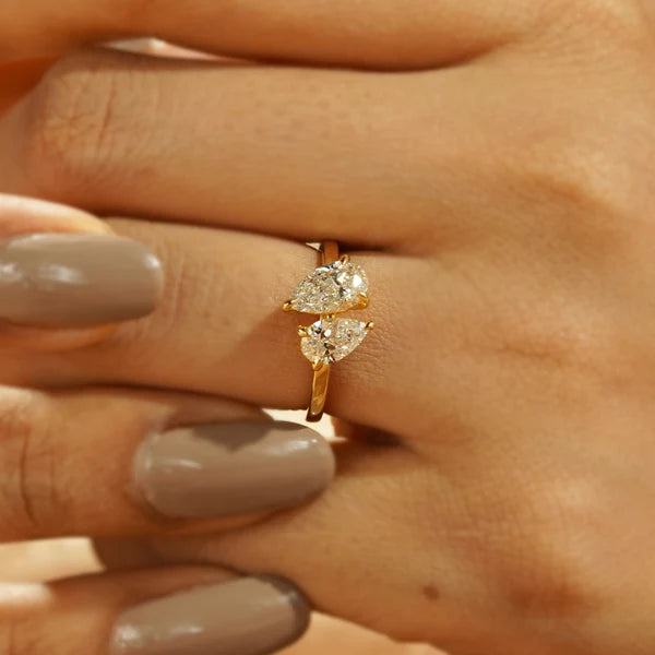 Pear and oval diamond toi et moi engagement ring in yellow gold
