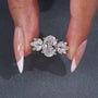 Oval cut diamond ring with 4 round prong setting and marquise accents
