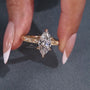 Vintage marquise diamond ring with 6 claw prong setting and side stones
