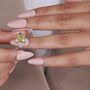 Fancy yellow cushion cut three stone engagement ring