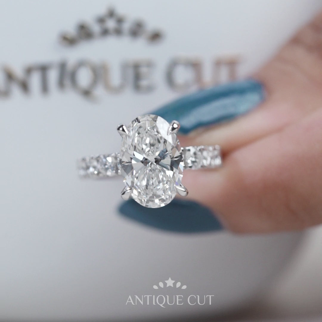 Platinum oval engagement ring with side diamonds
