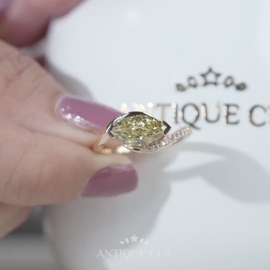 Contemporary yellow diamond marquise cut engagement ring