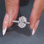 Oval cut diamond ring with 4 round prong setting and marquise accents
