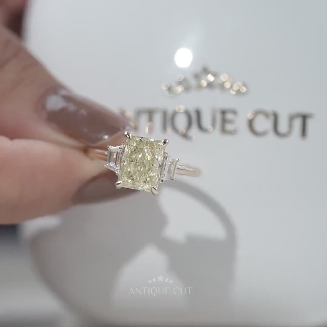 Yellow gold radiant diamond ring with trapezoid accents