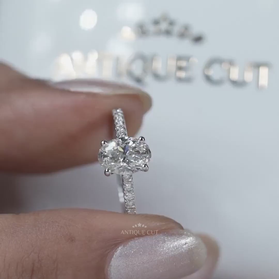 Oval cut diamond ring with pave band