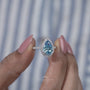 White gold blue pear diamond engagement ring halo design