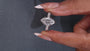 Hidden halo engagement ring with round side stones
