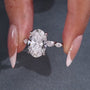 5 carat oval diamond engagement ring with marquise cut pavé band
