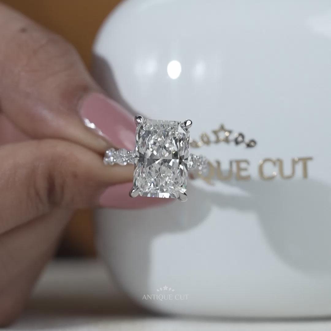 Radiant cut hidden halo engagement ring in white gold