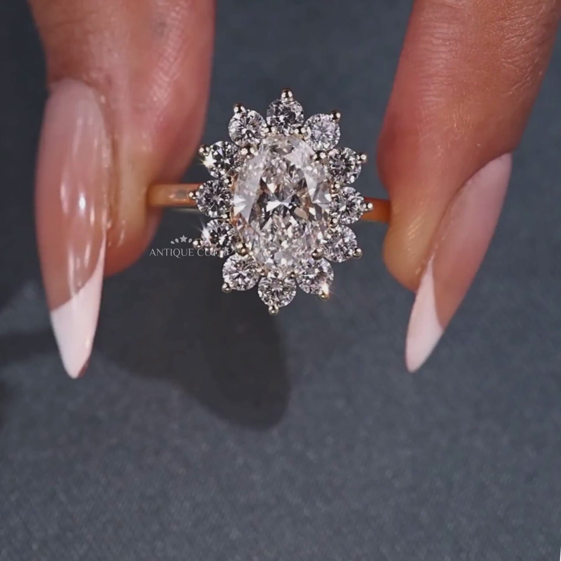 Floral halo ring featuring an oval cut lab grown diamond