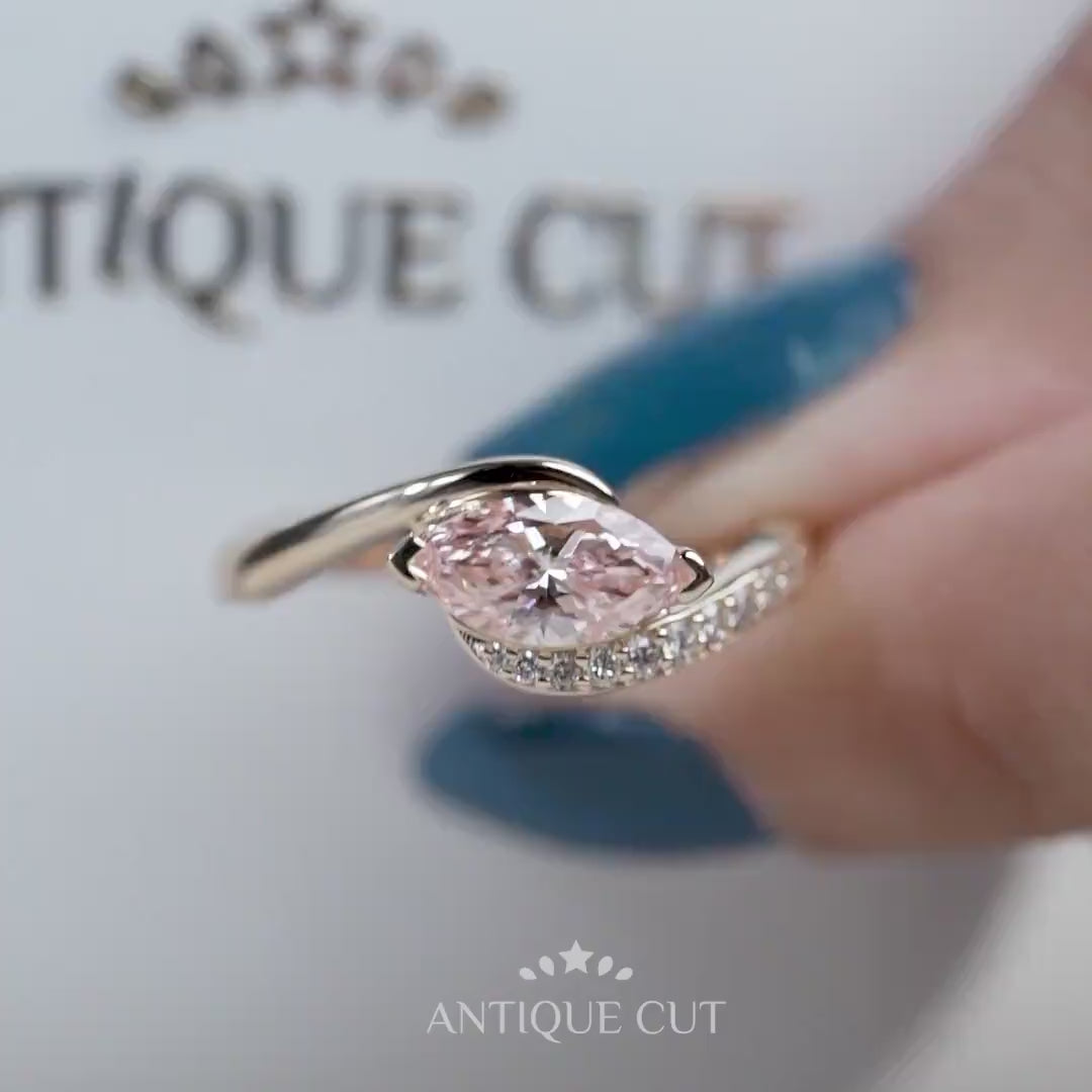 Flowing bypass engagement ring with fancy pink marquise diamond