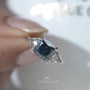 Elegant cushion cut blue diamond engagement ring with side stones