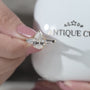 Yellow gold pear diamond engagement ring with baguette side stones