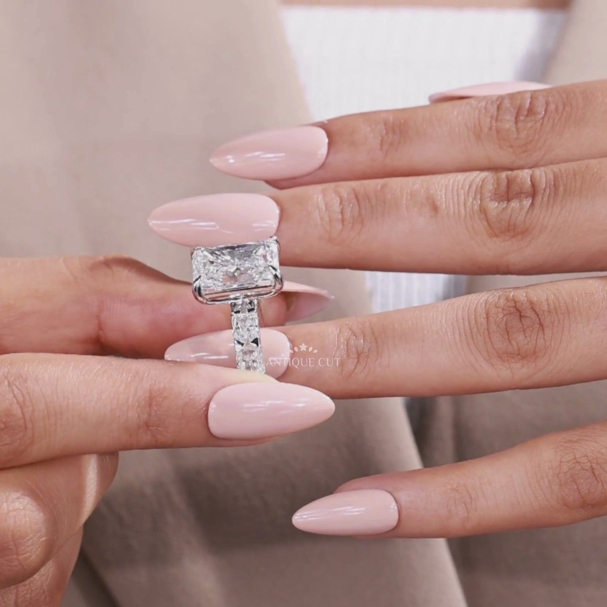 Radiant cut lab grown diamond ring featuring elegant side stone accents for engagement