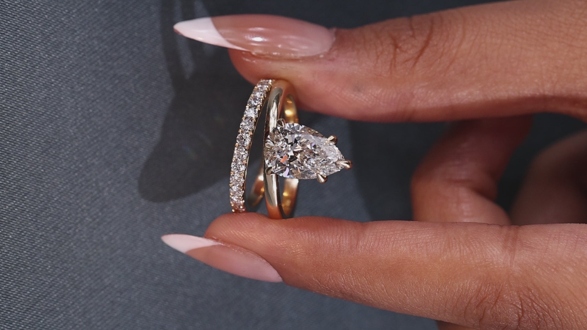Pear-shaped lab grown diamond ring with pavé band
