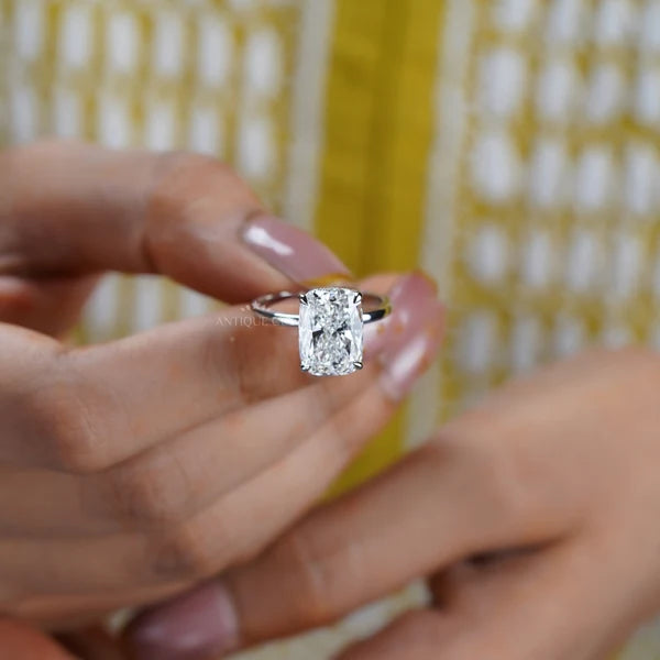 Yellow gold diamond ring with oval center and round diamond accents