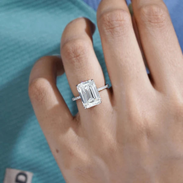 white gold emerald cut hidden halo diamond ring