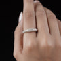 Luxury pave set diamond band crafted in yellow gold with a low profile design.