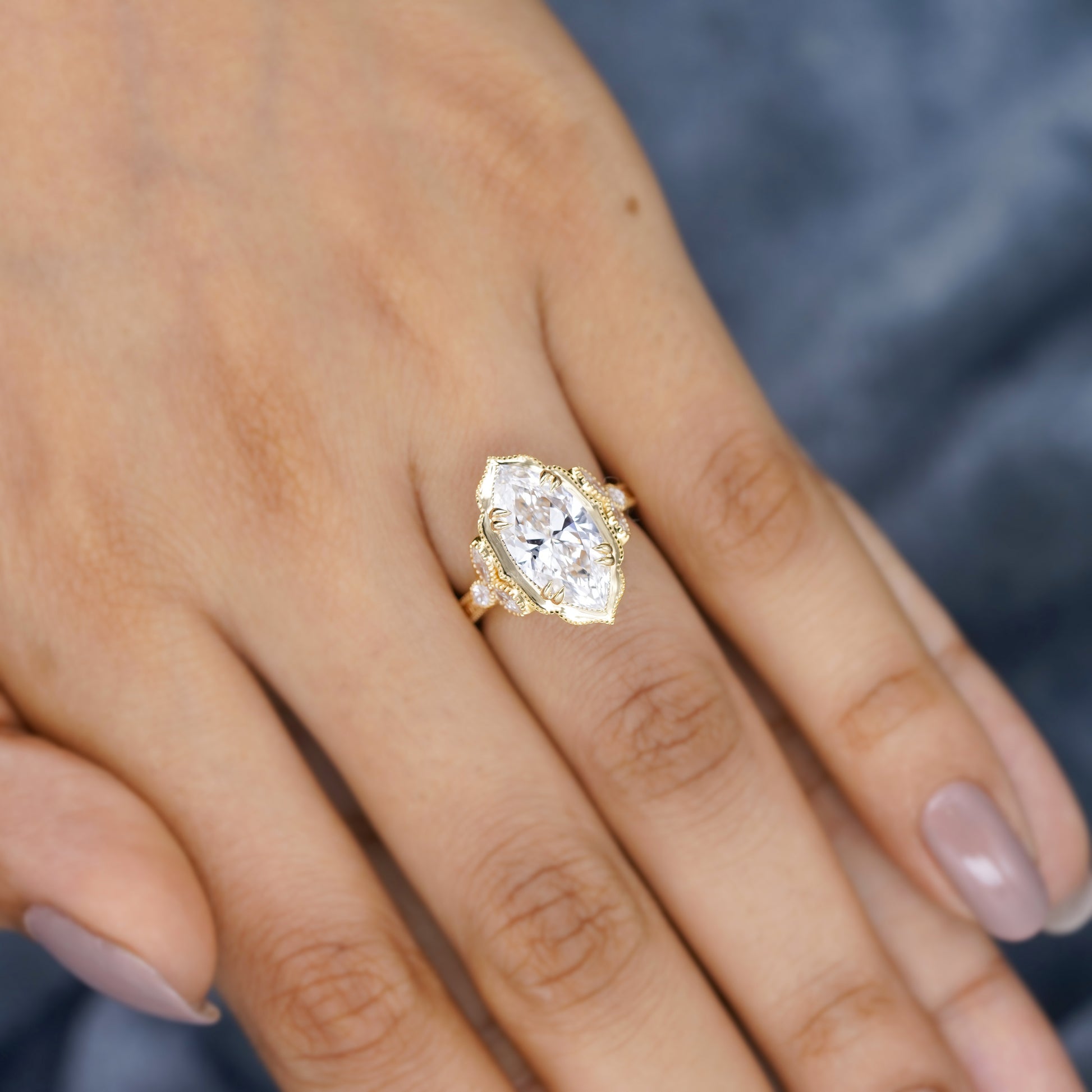 Marquise diamond vintage engagement ring with side stones