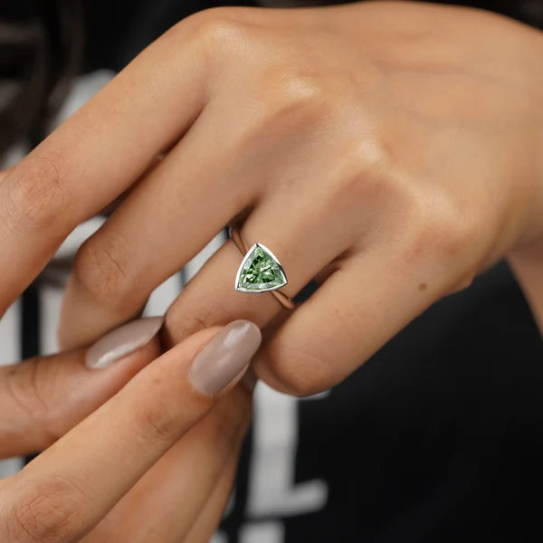 White gold trillion green diamond engagement ring bezel set