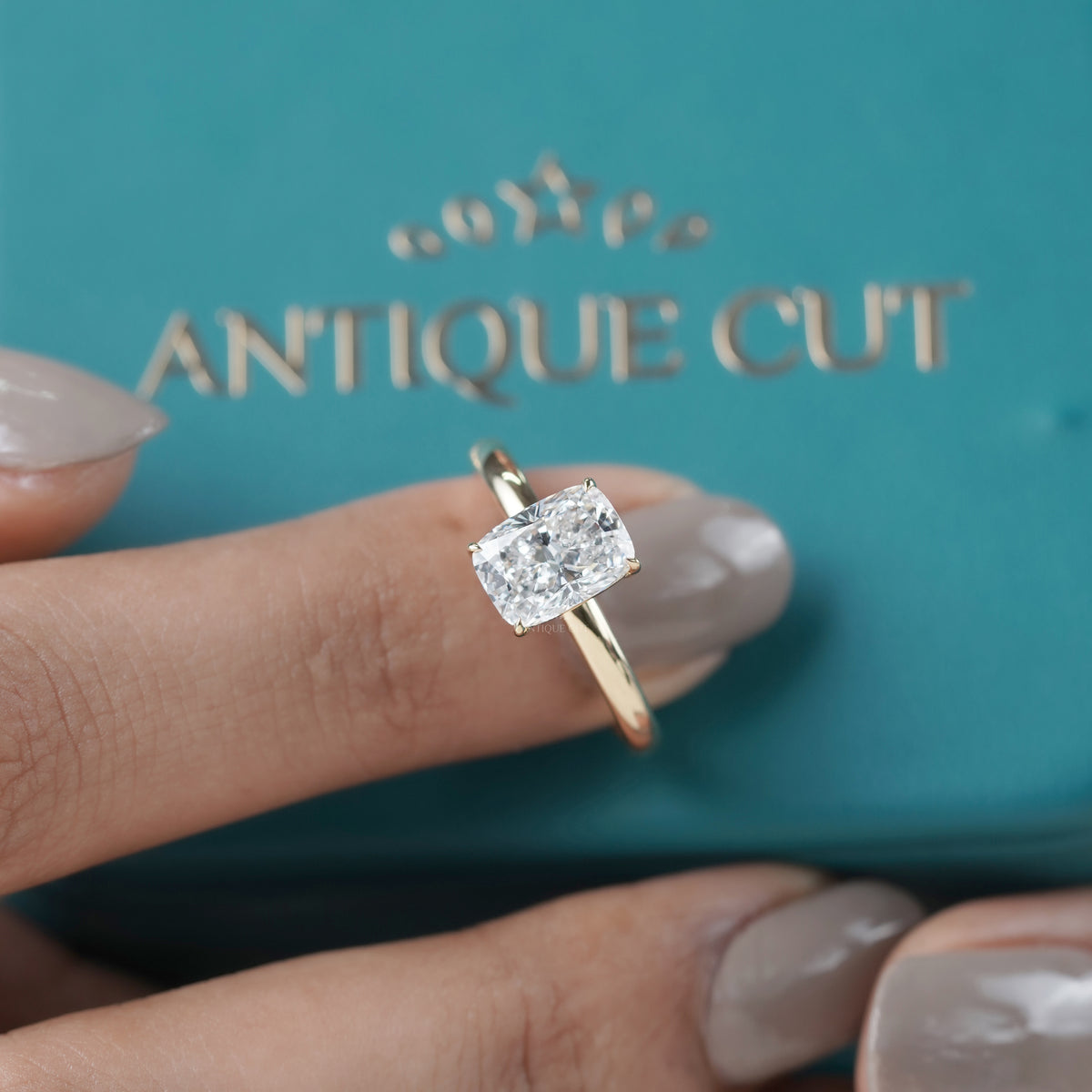 Cushion cut diamond solitaire engagement ring 