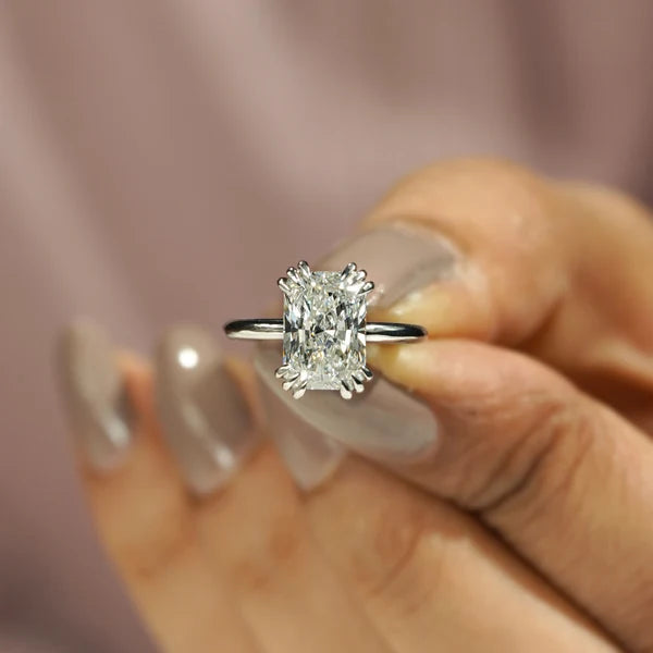 White gold radiant diamond solitaire ring with four prong