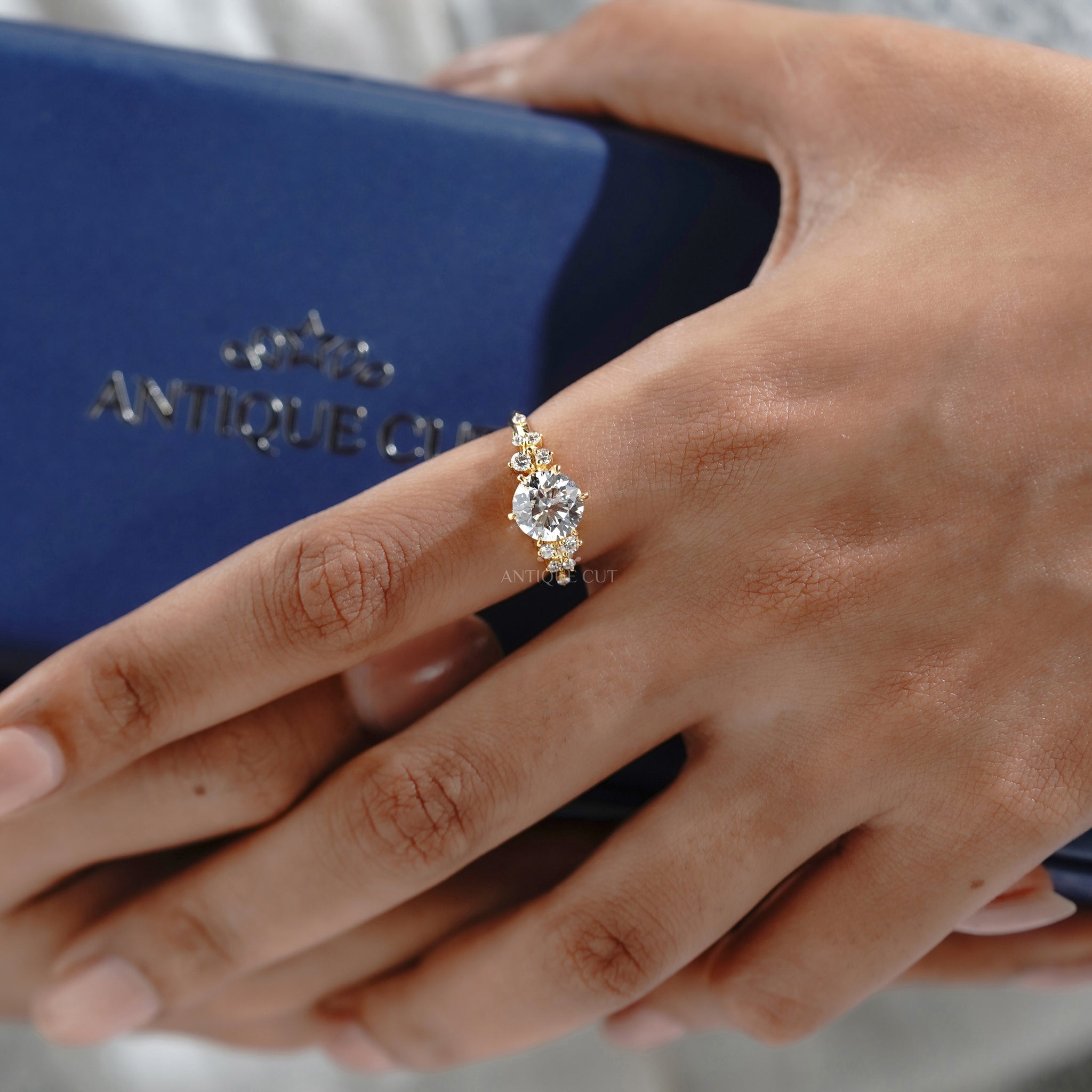 Round diamond floral engagement ring with yellow gold band