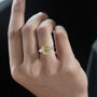 Fancy yellow radiant cut diamond engagement ring with baguette side stones