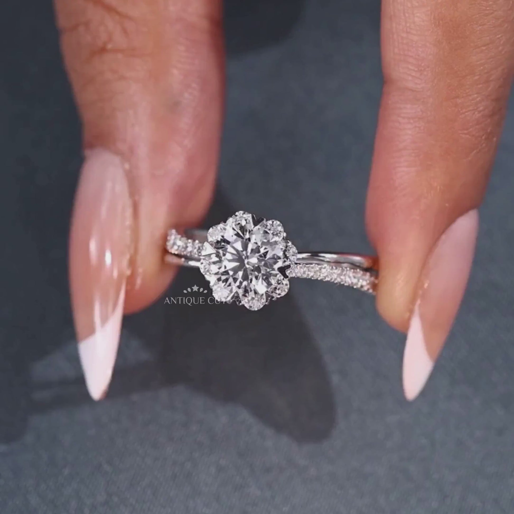 Round cut diamond halo ring with cathedral setting in white gold
