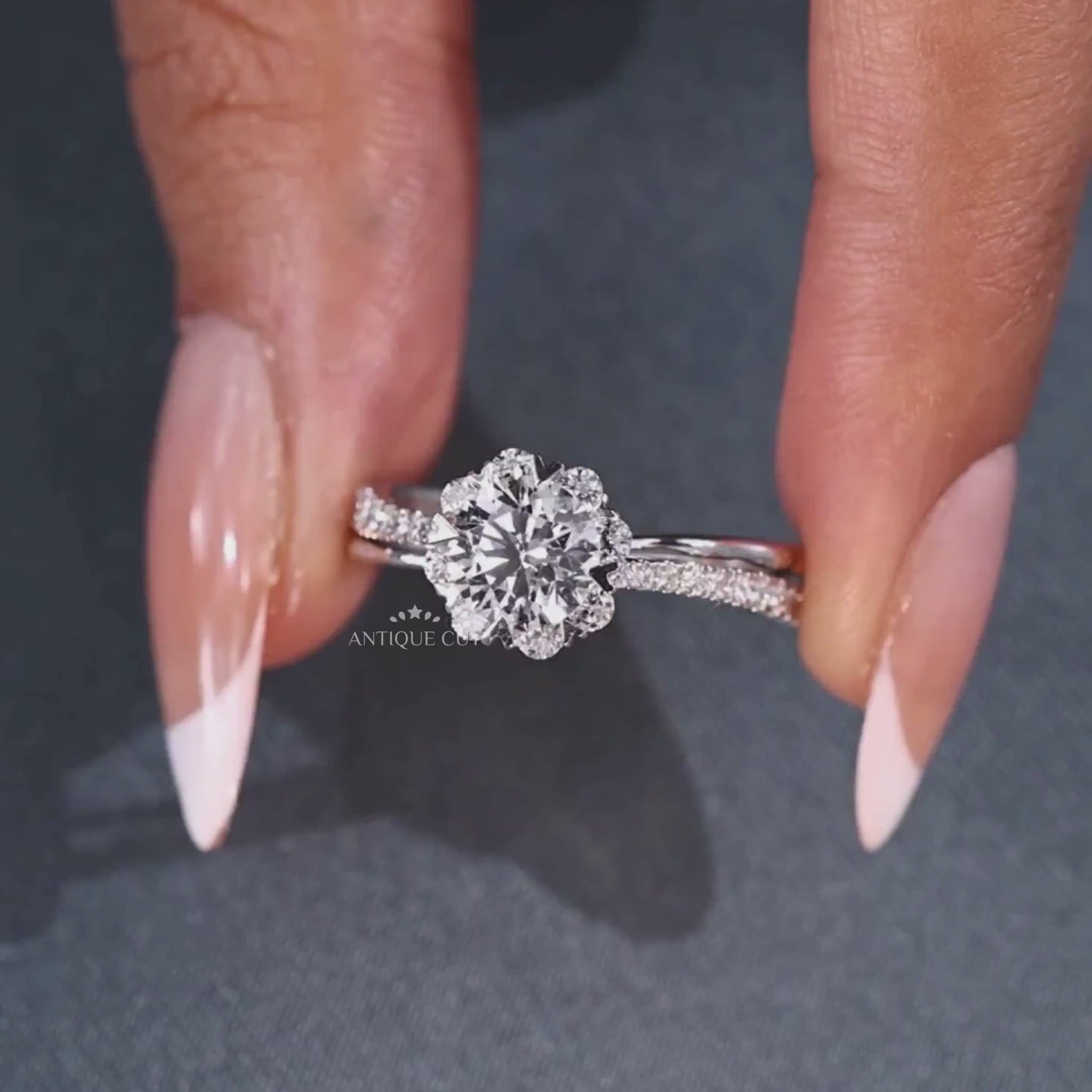 Round cut diamond halo ring with cathedral setting in white gold
