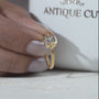 Close-up of letter B diamond ring in yellow gold