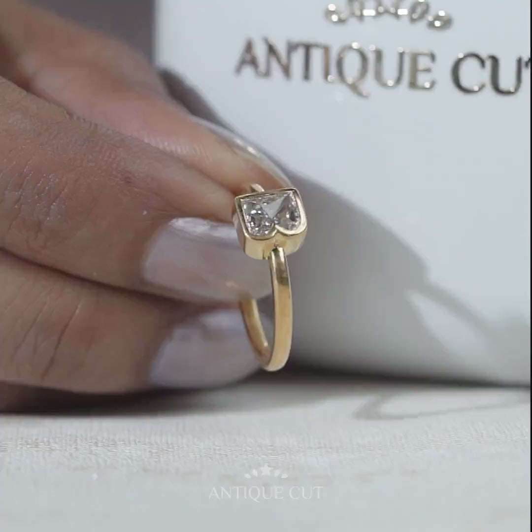 Close-up of letter B diamond ring in yellow gold