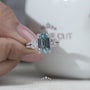 White gold cushion blue diamond engagement ring