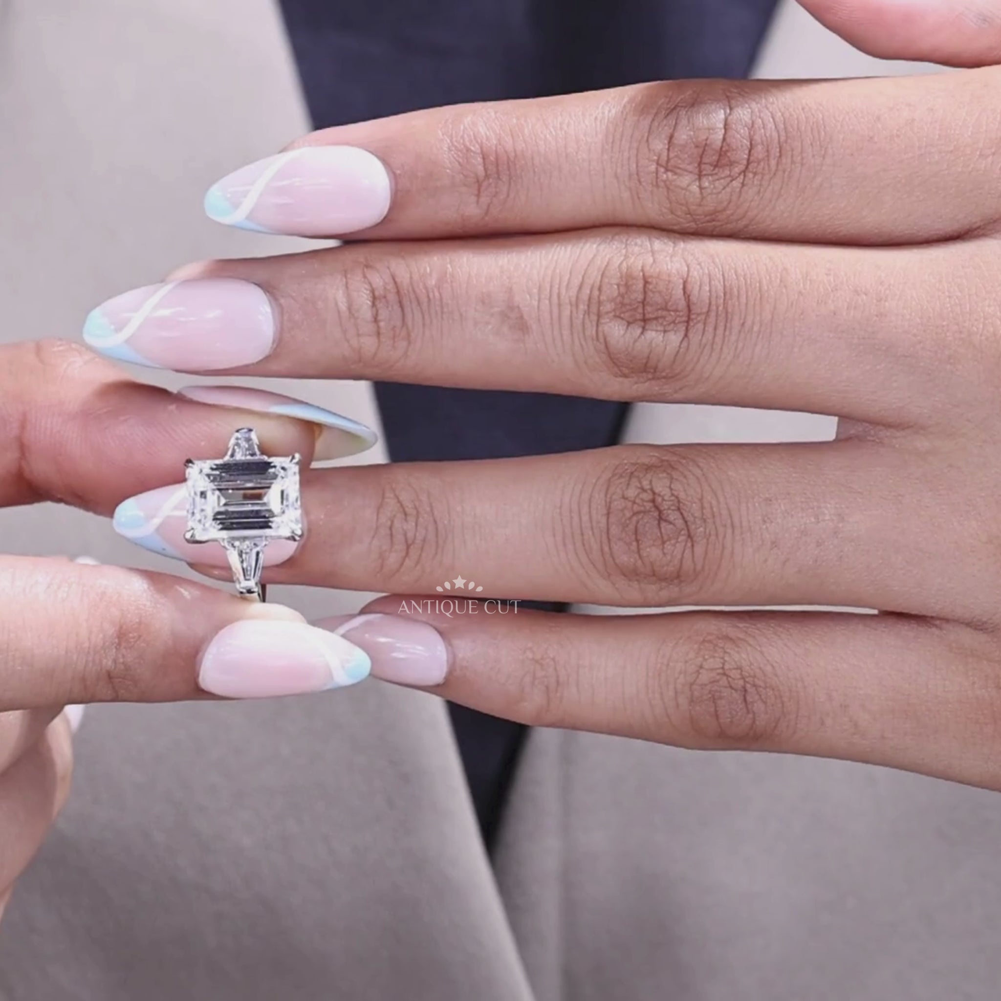 Three Stone Lab Grown Emerald Cut Engagement Ring with tapered baguette