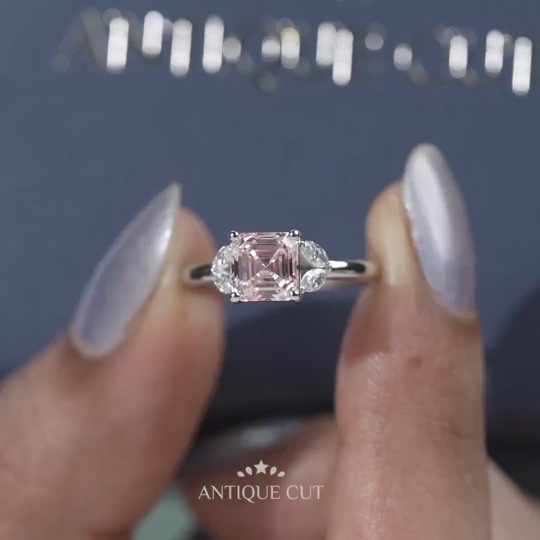 White gold Asscher diamond ring with marquise side stones