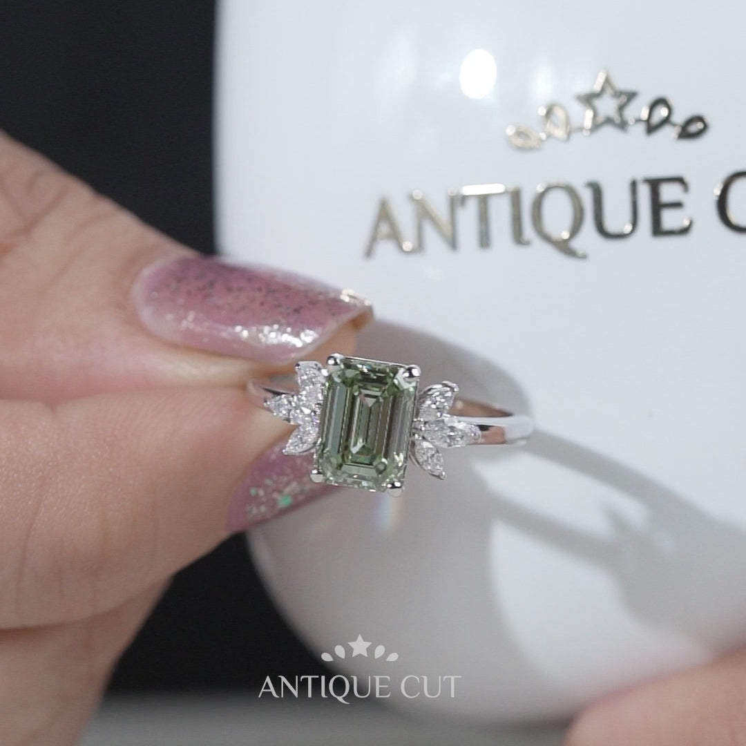 White gold emerald cut light green diamond ring